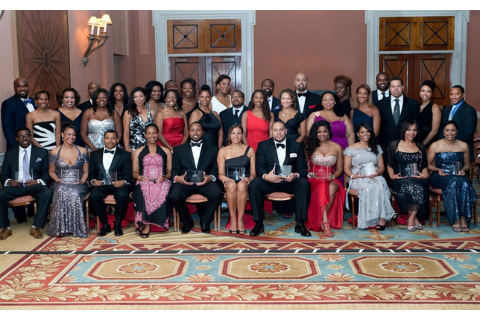 Image of National Bar Association members standing in three roaws in gala attire.